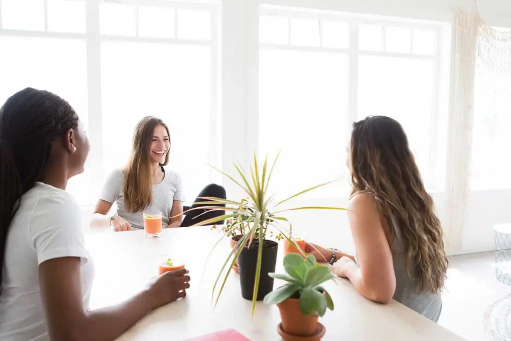 Group of three friends chatting