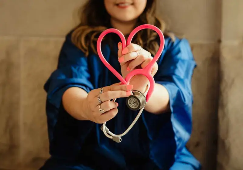 woman holding stethoscope