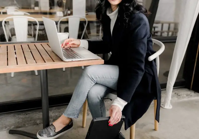 Woman sitting with laptop