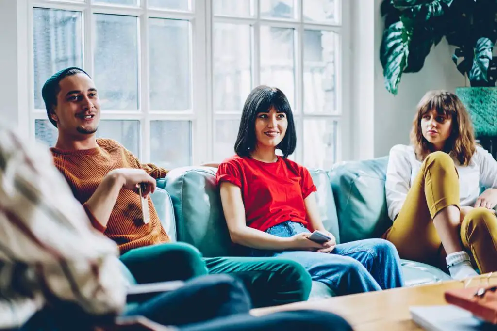 Friends sitting on couch together